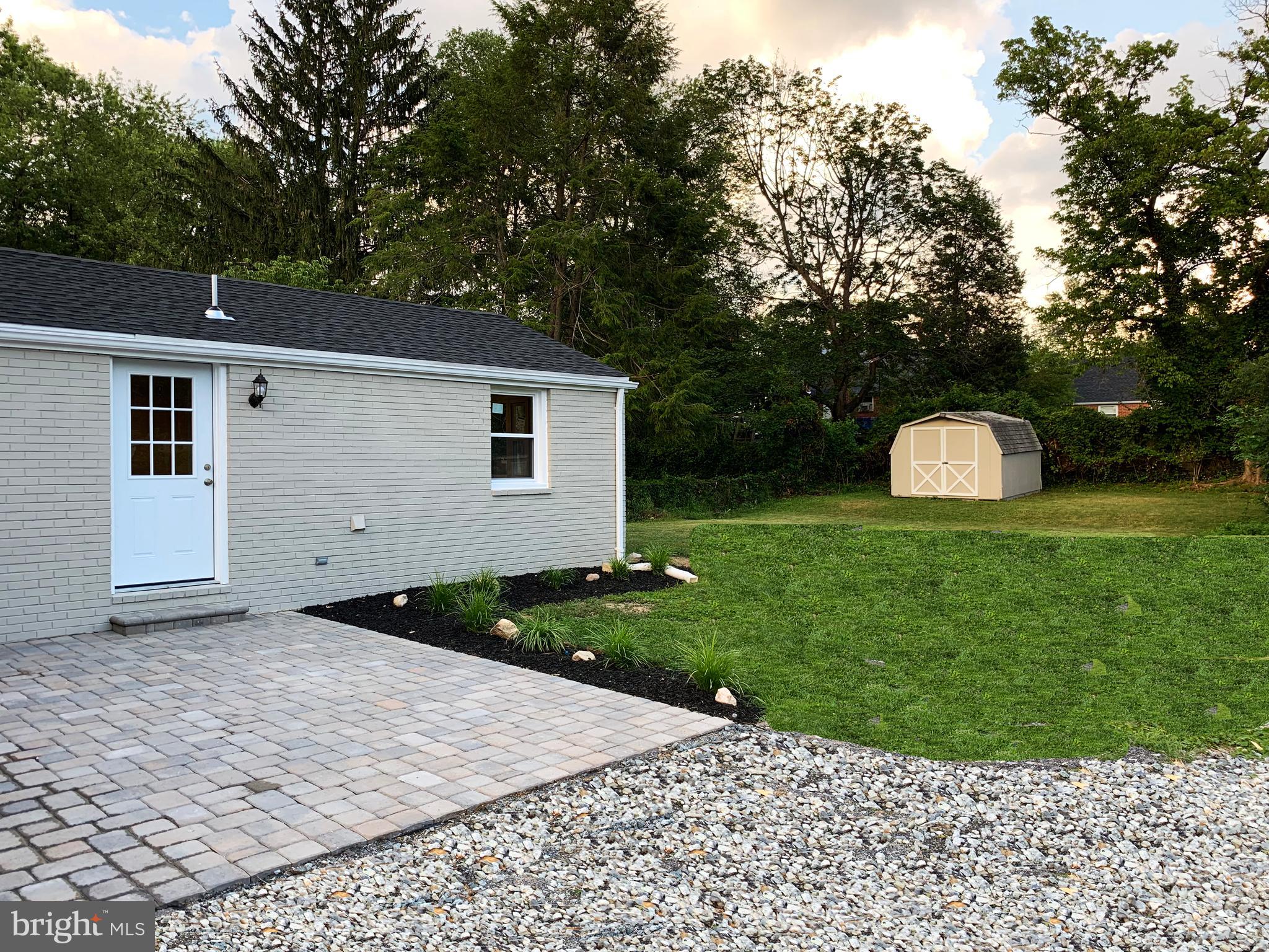 12707 Gould Road Silver Spring, MD 20906 - Photo 22 of 23 a backyard of a house with lots of green space