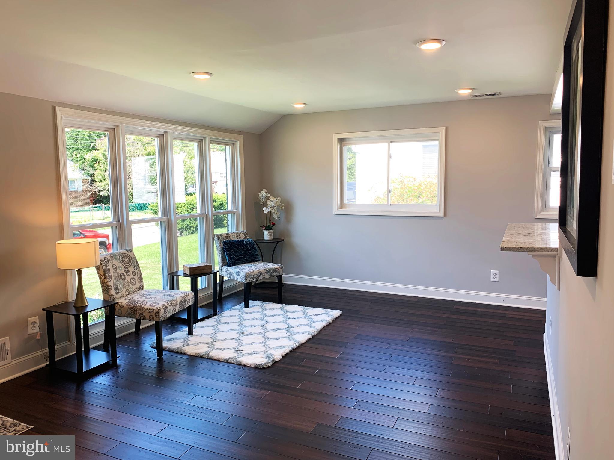 12707 Gould Road Silver Spring, MD 20906 - Photo 9 of 23 a living room with furniture and a large window