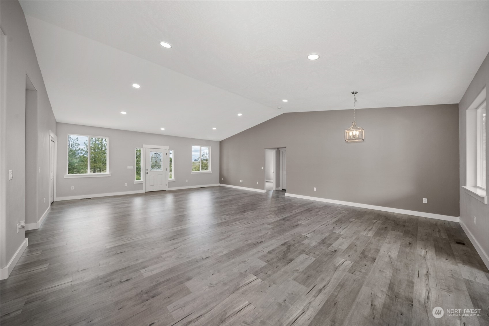 35349 South Bootstrap Lane Cheney, WA 99004 - Photo 3 of 27 an empty room with wooden floor and windows