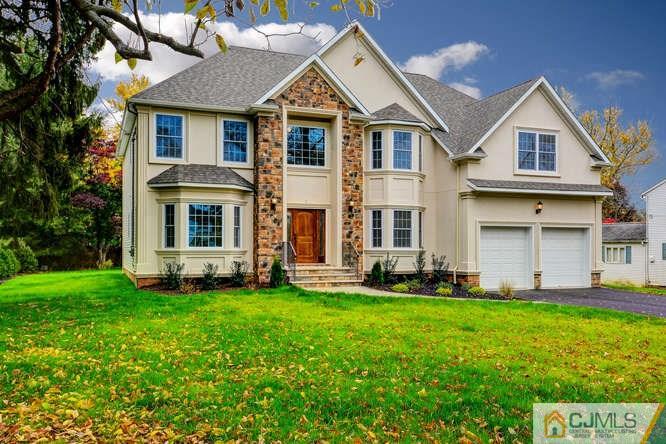 5 Homestead Road Edison, NJ 08820 - Photo 2 of 25 a front view of a house with a yard