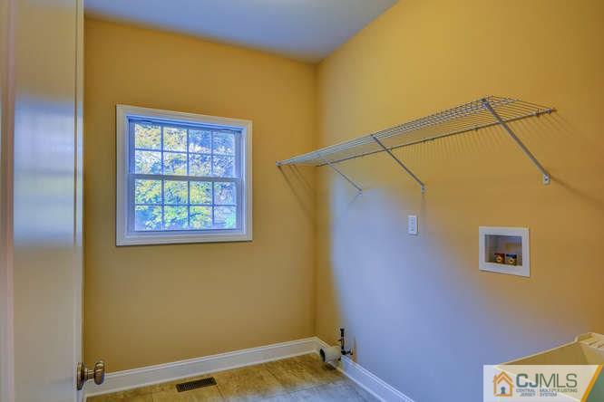 5 Homestead Road Edison, NJ 08820 - Photo 11 of 25 a view of a blue wall with a large window
