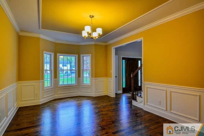 5 Homestead Road Edison, NJ 08820 - Photo 13 of 25 a view of an empty room with a window and wooden floor