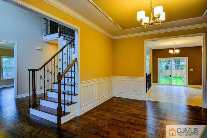 5 Homestead Road Edison, NJ 08820 - Photo 14 of 25 a view of entryway and hall with wooden floor