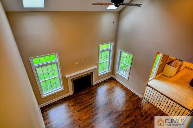 5 Homestead Road Edison, NJ 08820 - Photo 15 of 25 a view of an empty room with a window and wooden floor