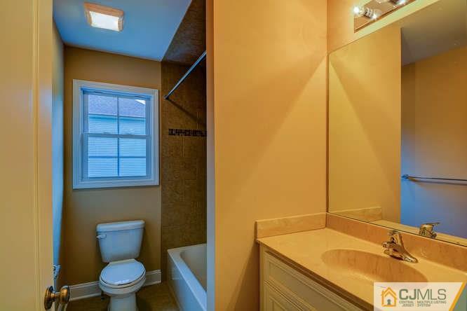 5 Homestead Road Edison, NJ 08820 - Photo 16 of 25 a bathroom with a sink and a toilet