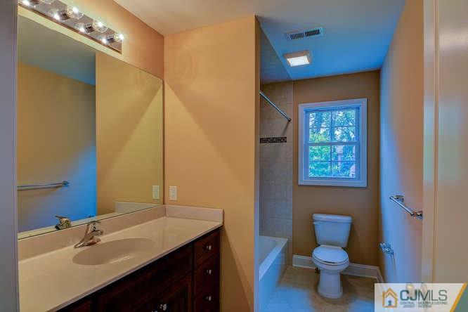 5 Homestead Road Edison, NJ 08820 - Photo 19 of 25 a bathroom with a sink and a toilet