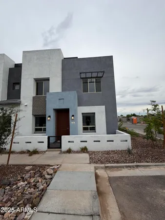 a front view of a house with yard