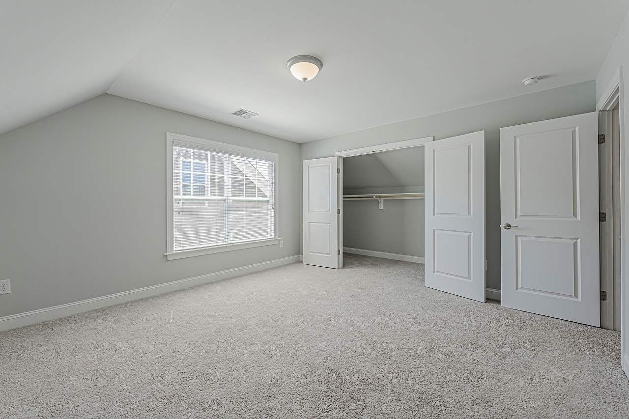 7605 Stonehenge Farm Lane Raleigh, NC 27613 - Photo 26 of 30 Large 3rd floor bedroom with plenty of closets 3rd floor bedroom