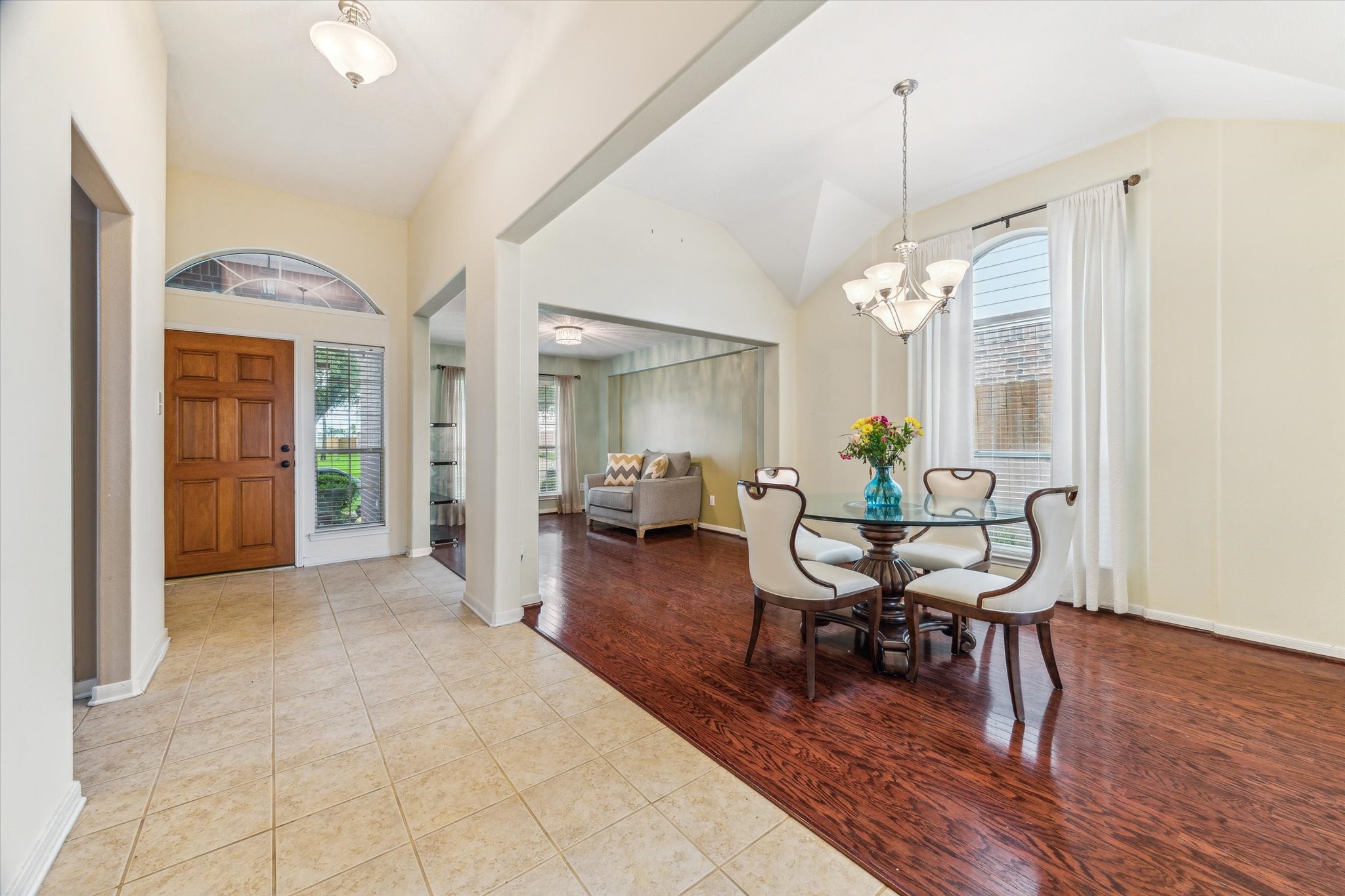 5716 Meadow Breeze Lane Rosharon, TX 77583 - Photo 2 of 24 Long Entryway showing the formals and beautiful tile floors.