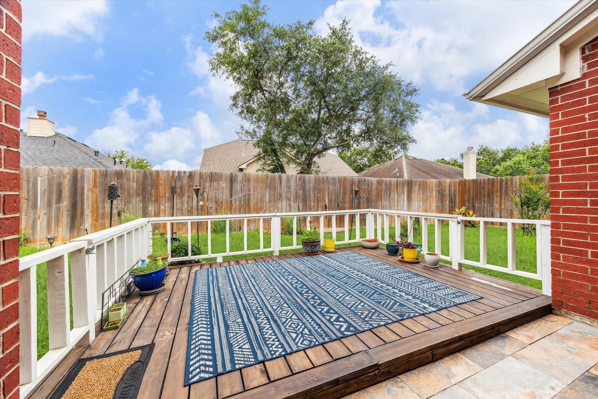 5716 Meadow Breeze Lane Rosharon, TX 77583 - Photo 22 of 24 Nice deck for relaxing. Gate doors open on left and right side.