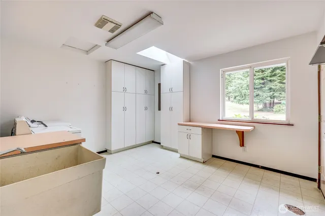 a view of a livingroom with furniture and windows