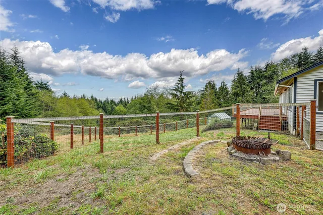 a view of a swimming pool with a couple of chairs
