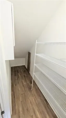 a view of a pathway door with wooden floor