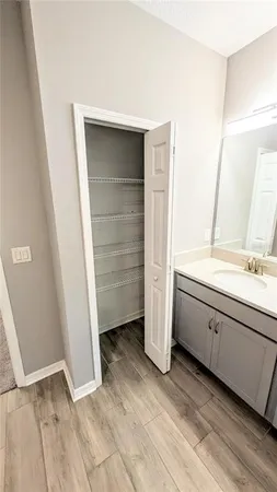 a view of a room with wooden floor