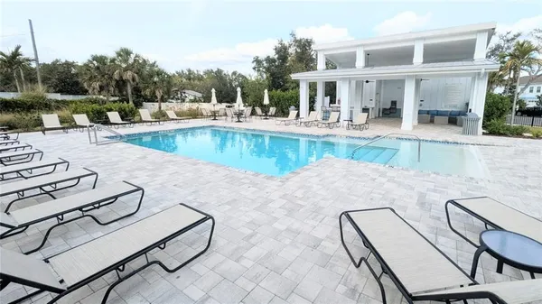 a view of a lake with houses in the back