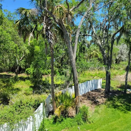a view of a lake with a house in the background