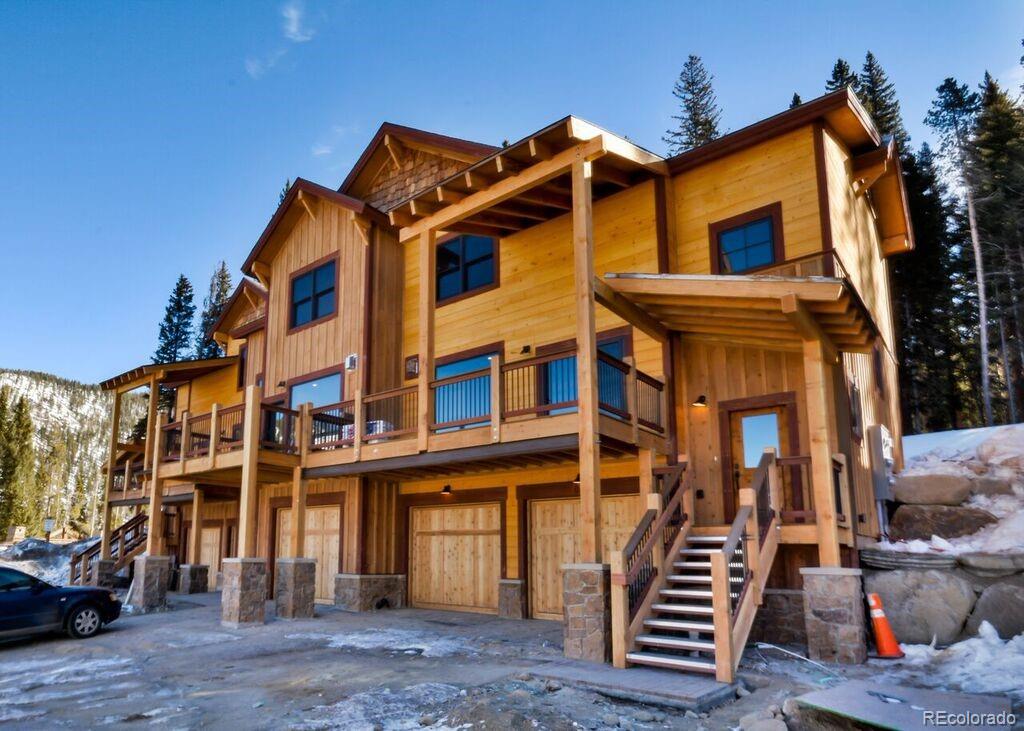 740 Independence Road, Unit 3C Keystone, CO 80435 - Photo 1 of 25 a front view of a residential apartment building with a yard