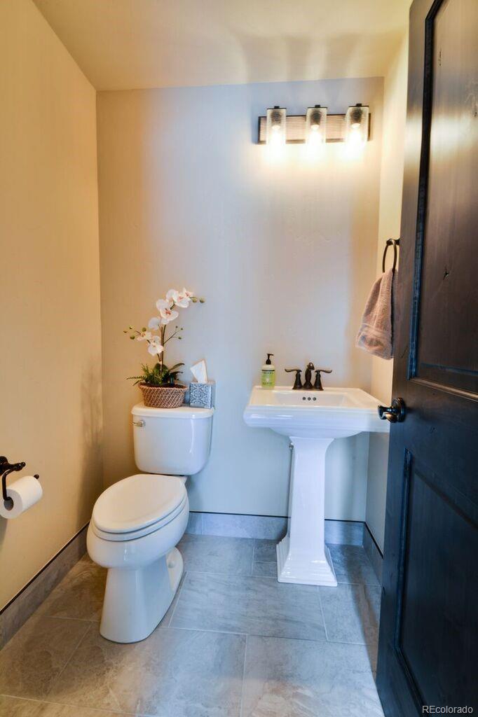 740 Independence Road, Unit 3C Keystone, CO 80435 - Photo 25 of 25 a bathroom with a sink toilet and a mirror
