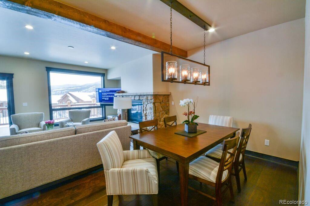 740 Independence Road, Unit 3C Keystone, CO 80435 - Photo 5 of 25 a dining room with furniture and a chandelier