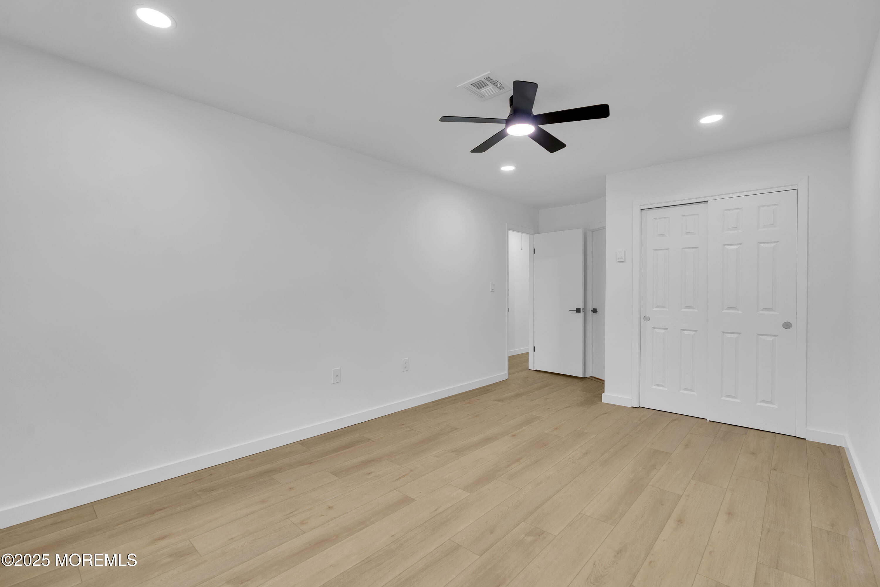 3 Tudor Court Brick, NJ 08723 - Photo 19 of 36 wooden floor in an empty room