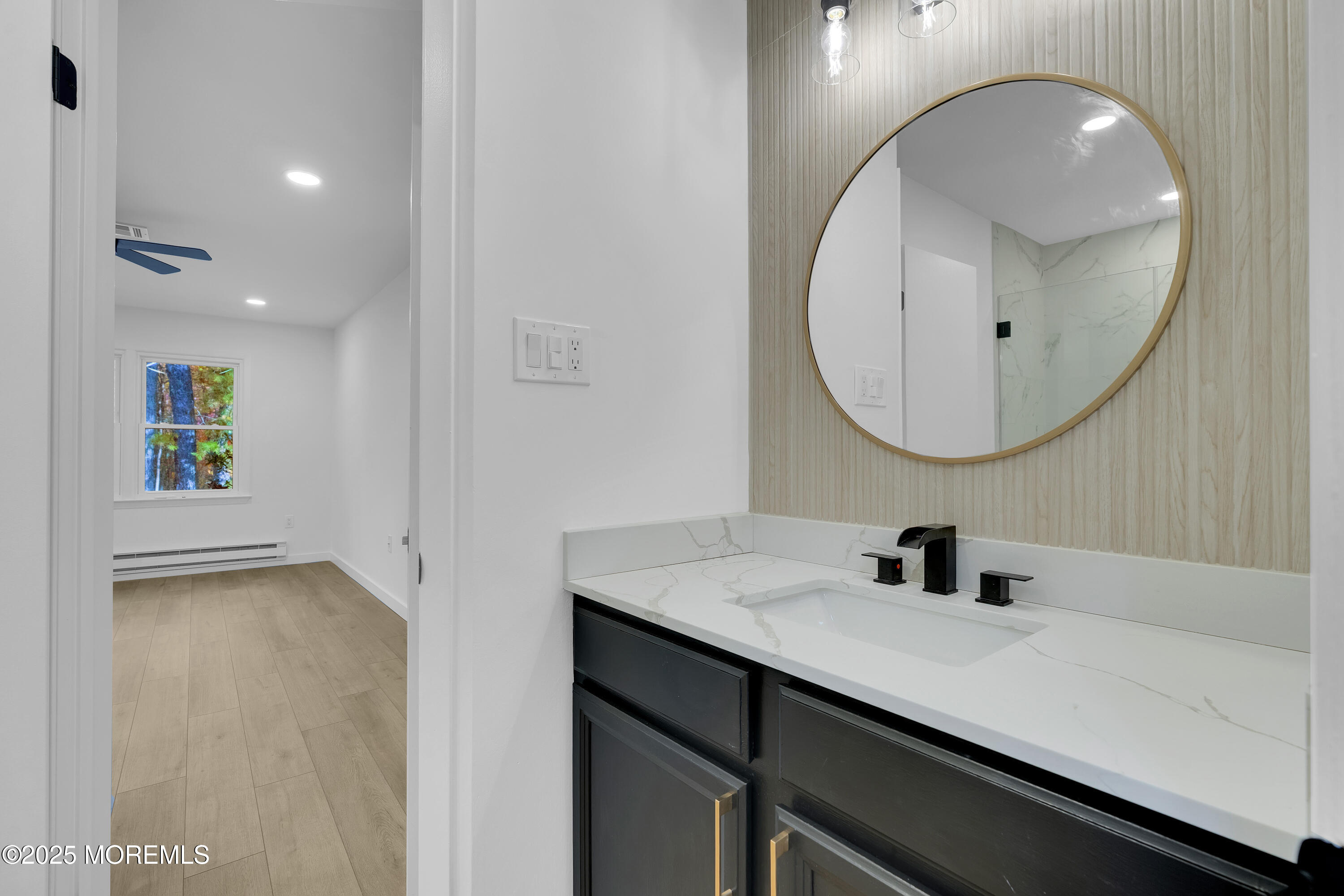 3 Tudor Court Brick, NJ 08723 - Photo 20 of 36 a bathroom with a sink and a mirror