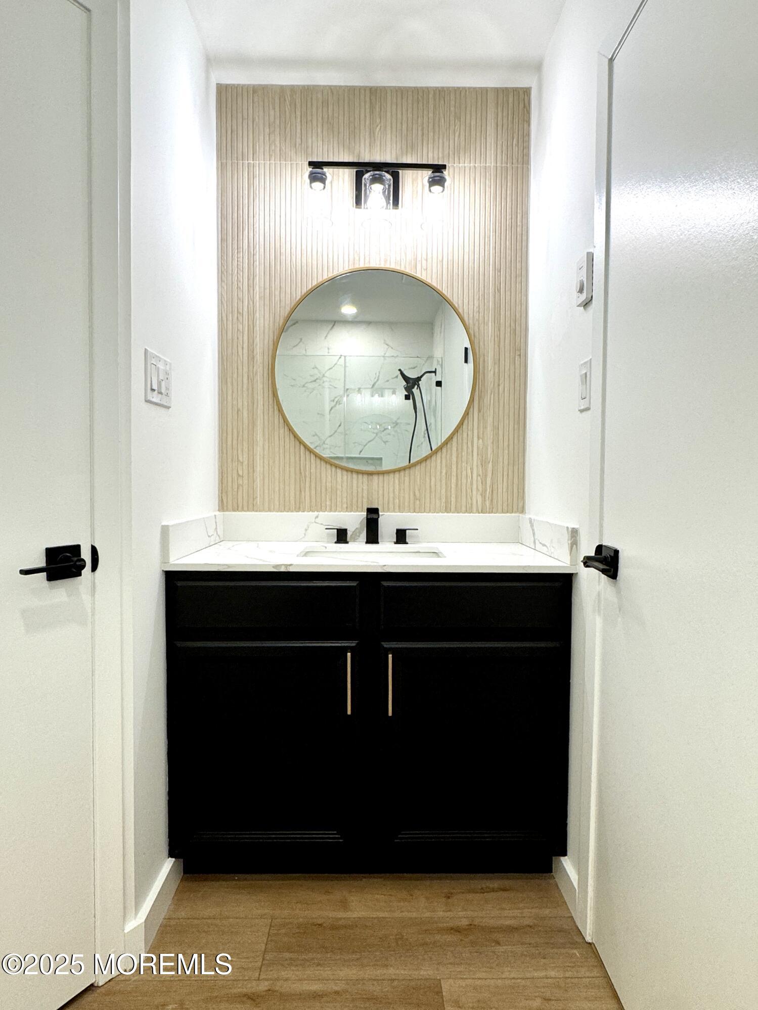 3 Tudor Court Brick, NJ 08723 - Photo 21 of 36 a bathroom with a sink and a mirror
