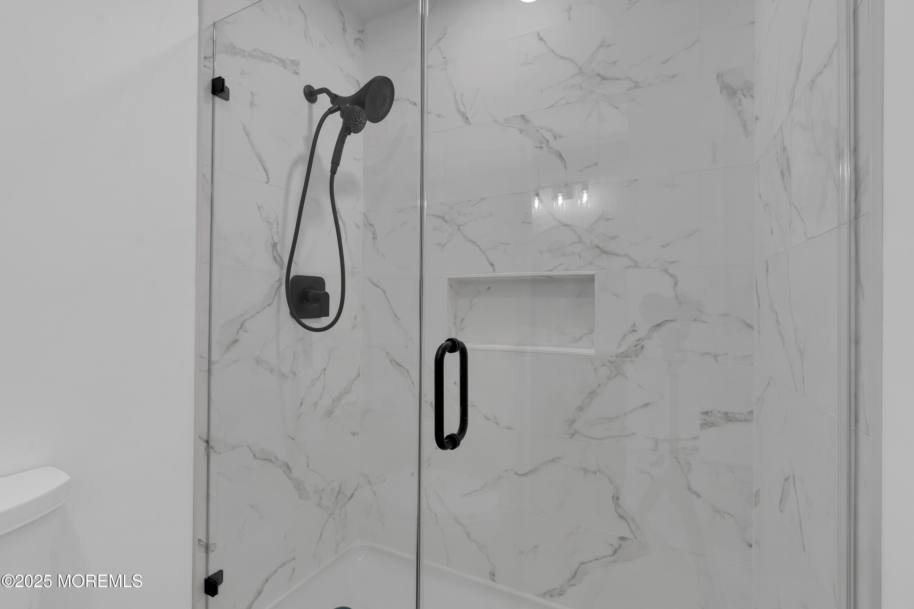 3 Tudor Court Brick, NJ 08723 - Photo 22 of 36 a bathroom with a shower