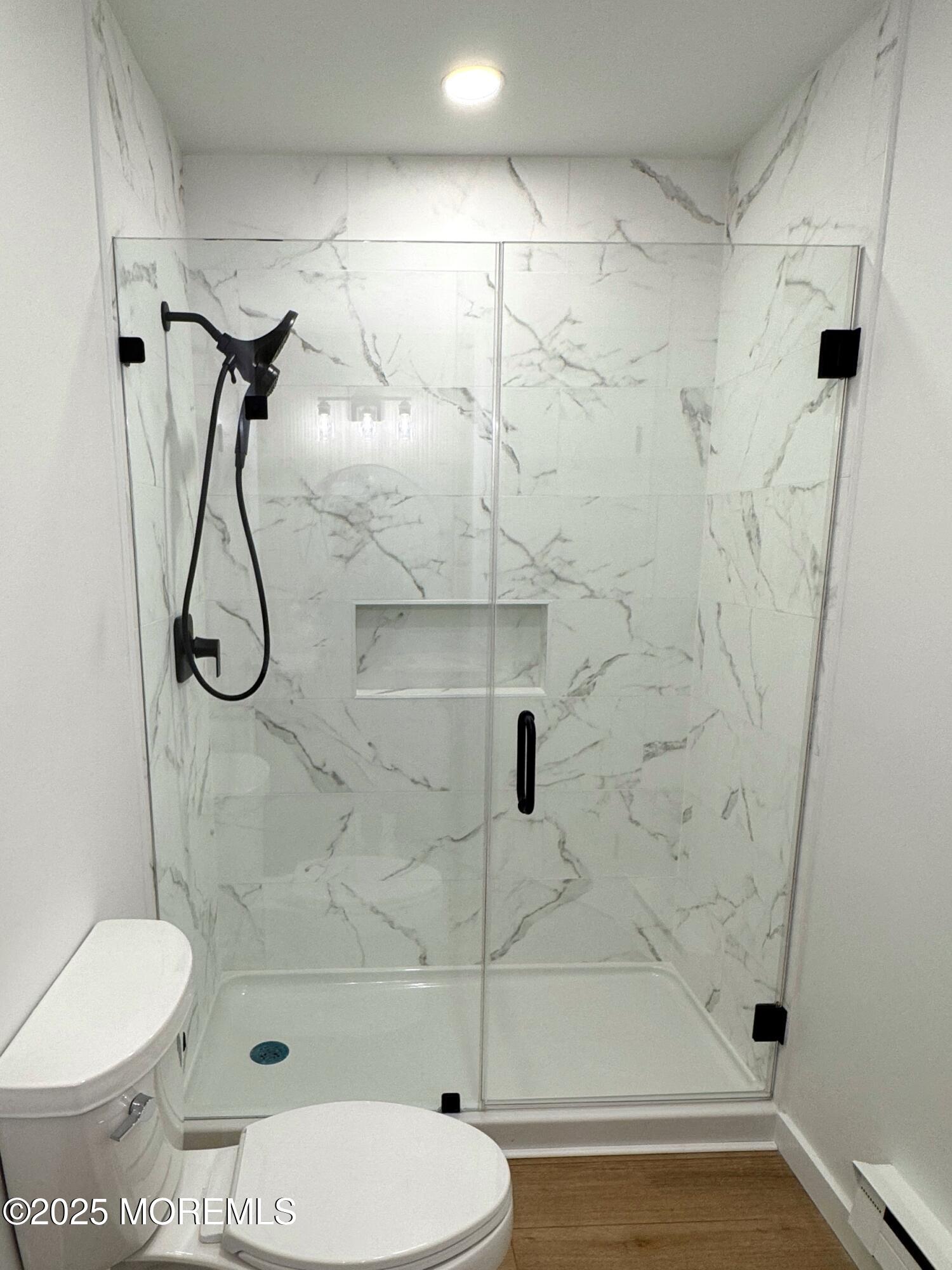 3 Tudor Court Brick, NJ 08723 - Photo 23 of 36 a bathroom with a toilet and a shower