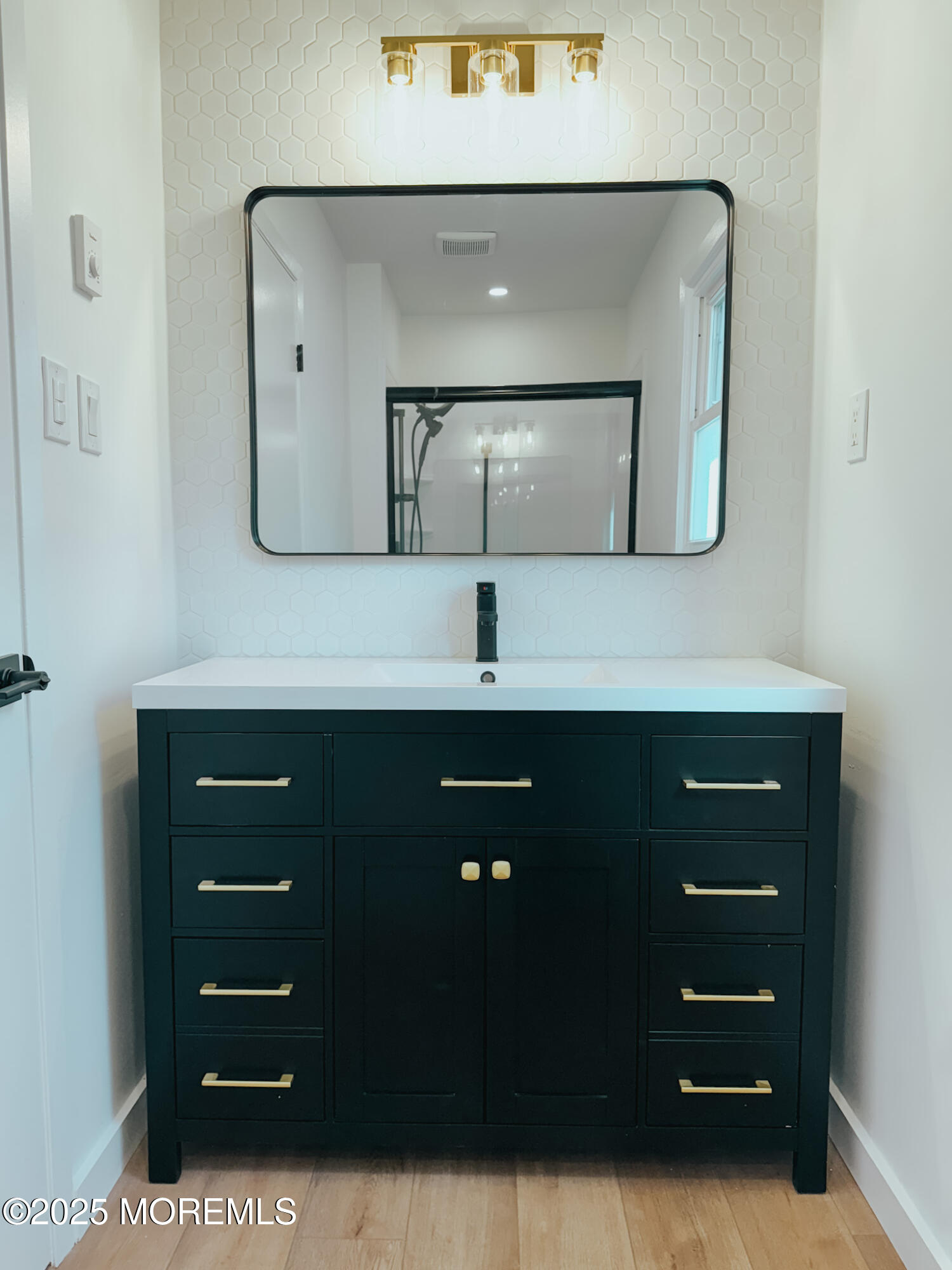 3 Tudor Court Brick, NJ 08723 - Photo 28 of 36 a bathroom with a sink vanity and mirror