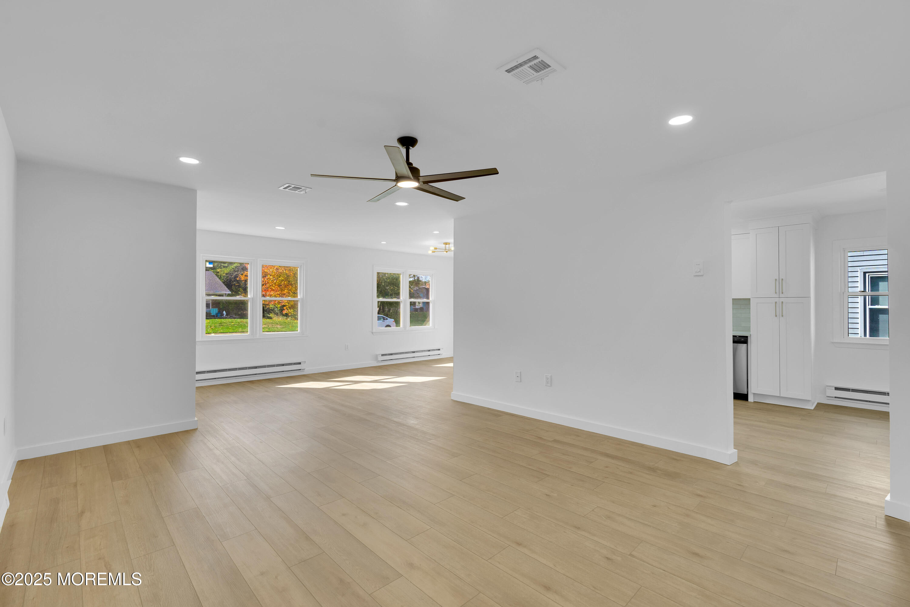 3 Tudor Court Brick, NJ 08723 - Photo 8 of 36 an empty room with wooden floor and windows