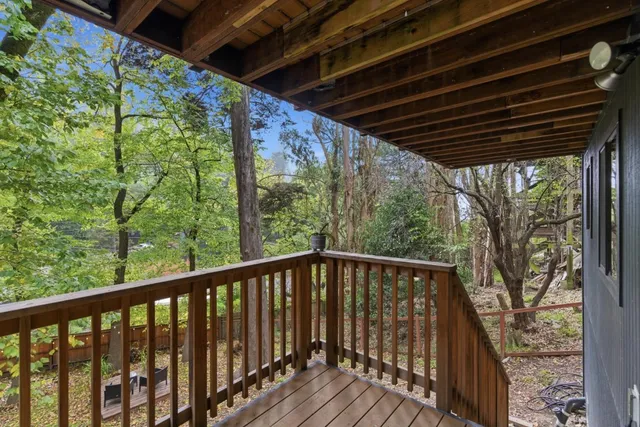 a view of balcony with wooden floor