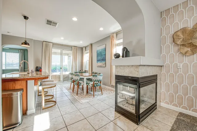 a dining room with furniture and a fireplace