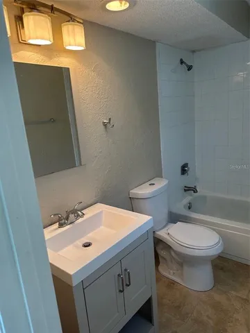 a bathroom with a toilet and a sink