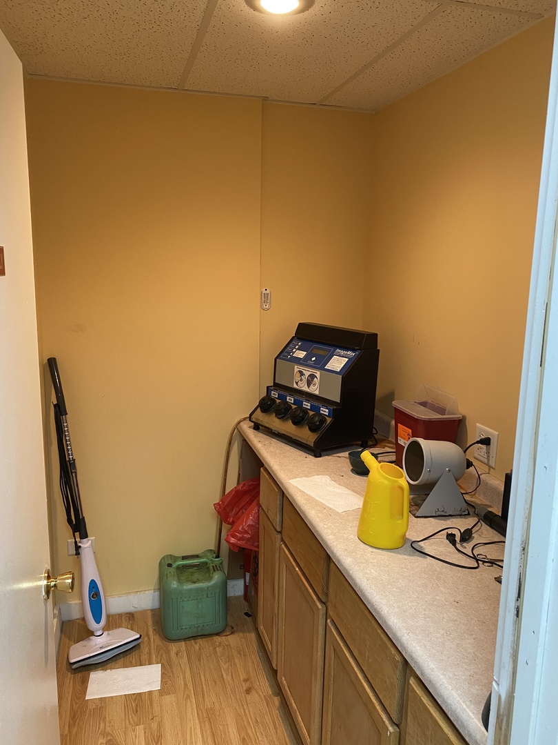 400 North Division Street Harvard, IL 60033 - Photo 13 of 13 a view of kitchen with a sink stove and wooden floor
