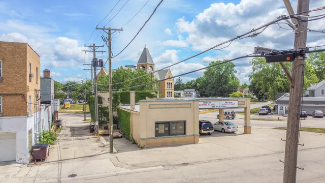 a view of a street with garage