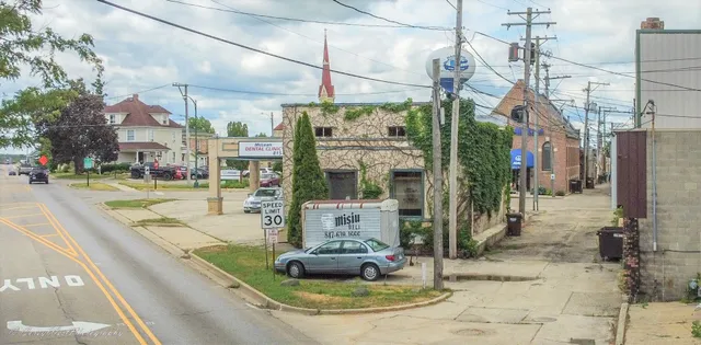 a view of a street with sitting area