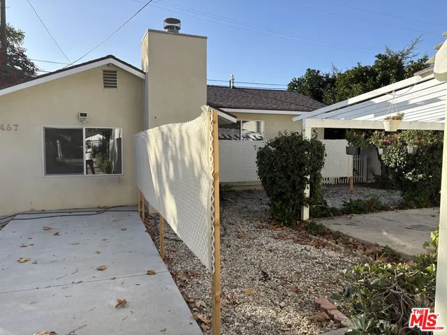 a backyard of a house with garden and patio
