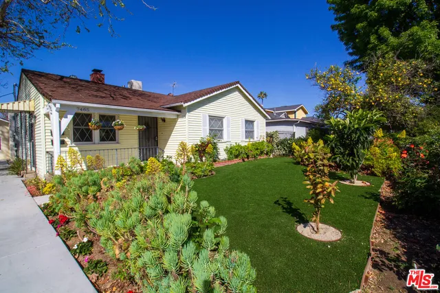 a view of a house with a garden
