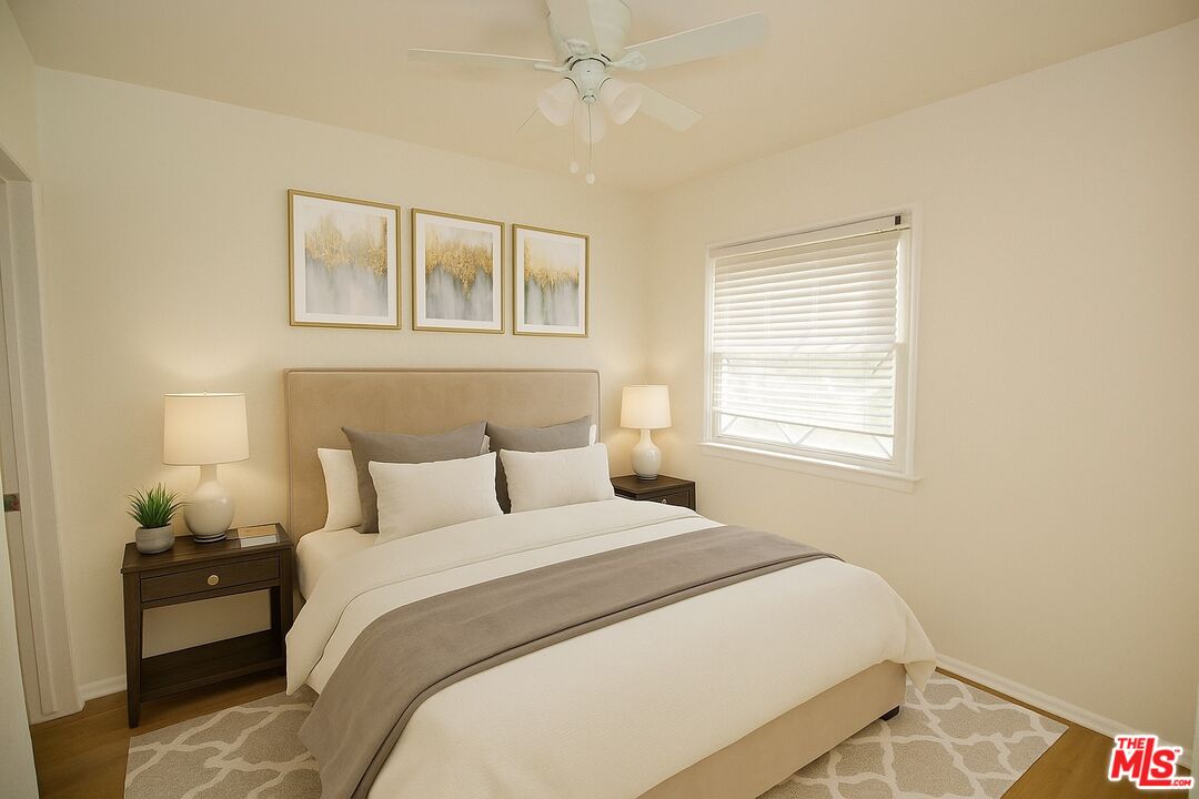 7465 North Forbes Ave Lake Lake Balboa, CA 91406 - Photo 6 of 13 a bedroom with a bed and a window