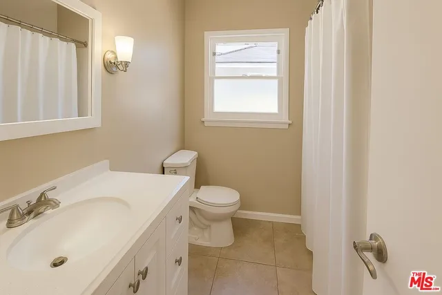 a bathroom with a sink toilet and vanity