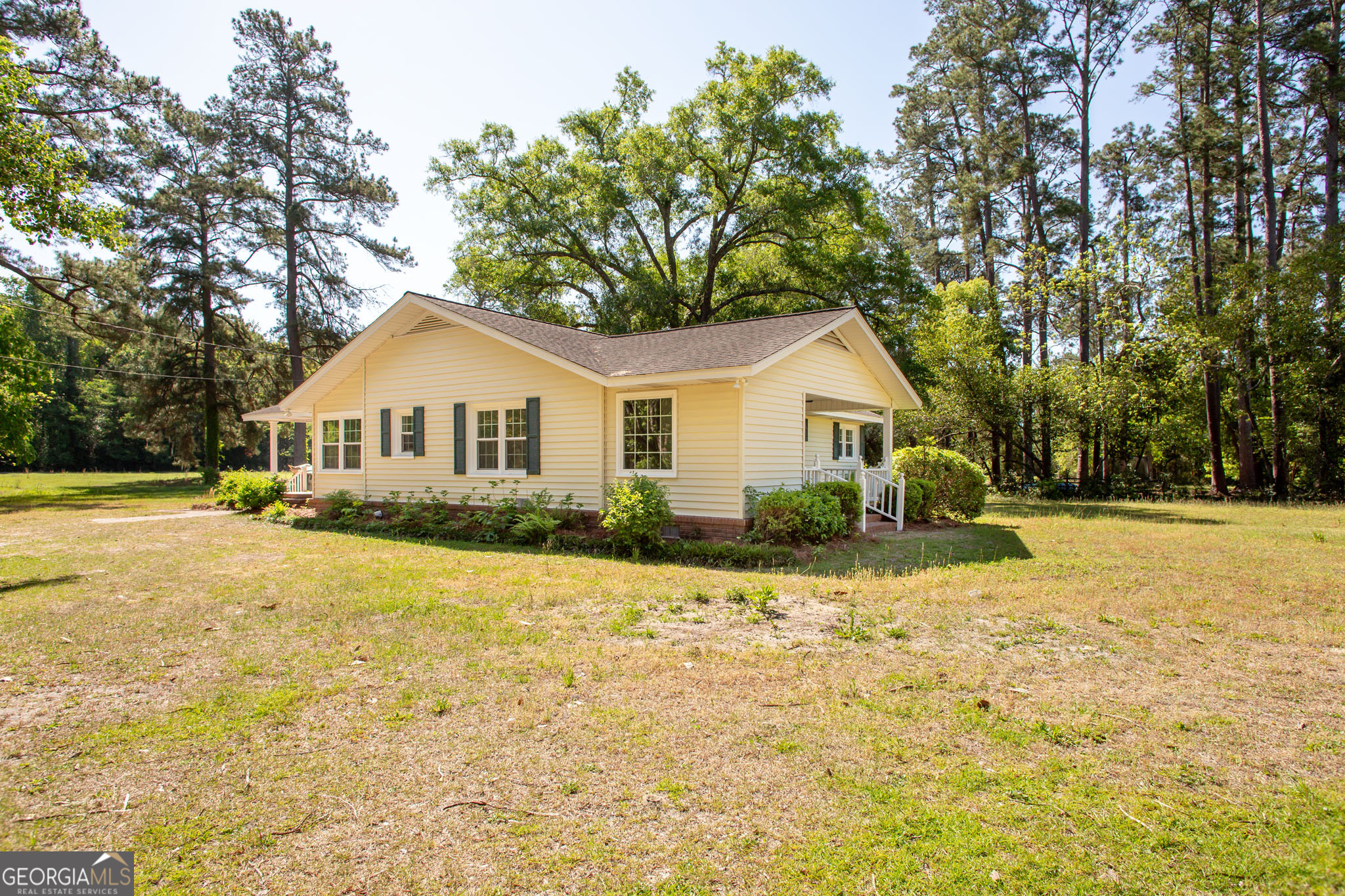 110 Briarwood Road Waycross, GA 31501 - Photo 4 of 35 a front view of a house with a yard and trees