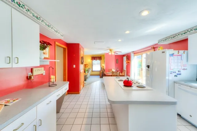a kitchen with stainless steel appliances kitchen island granite countertop a sink and cabinets