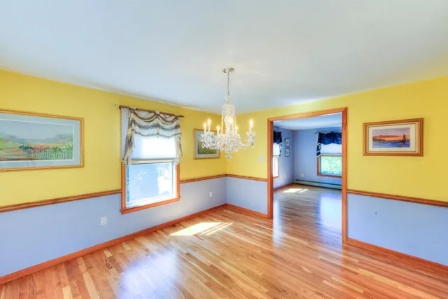 a view of a room with window and wooden floor
