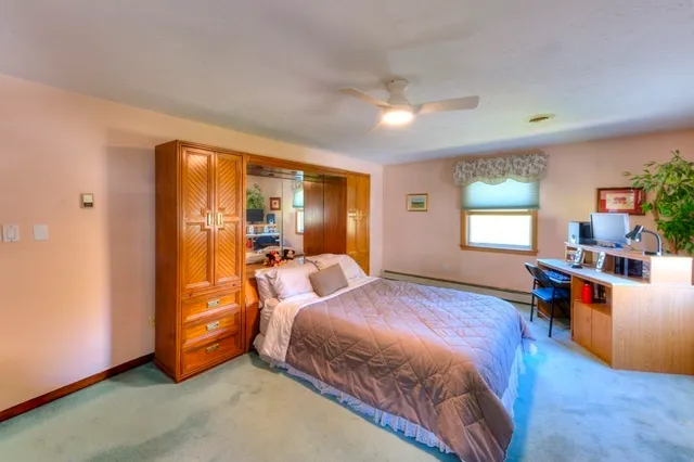 a bed room with a bed and a tv