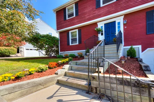 a view of house with outdoor space and sitting area