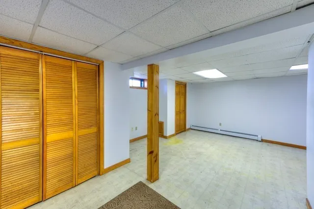 a view of a big room with windows