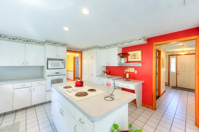 a kitchen that has a sink and a stove in it