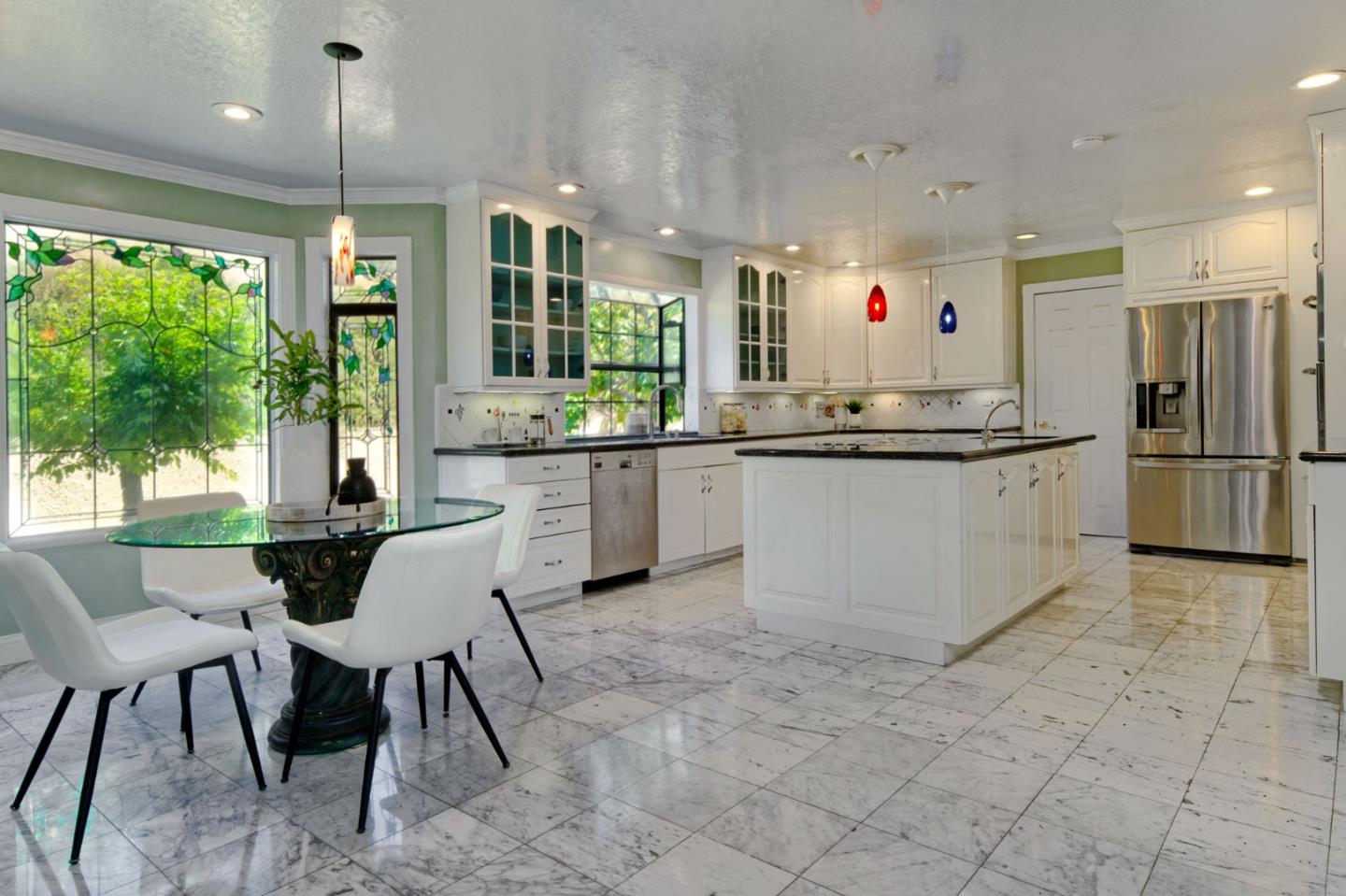 7790 Lost View Road San Jose, CA 95120 - Photo 17 of 48 a kitchen with stainless steel appliances granite countertop a sink and a refrigerator