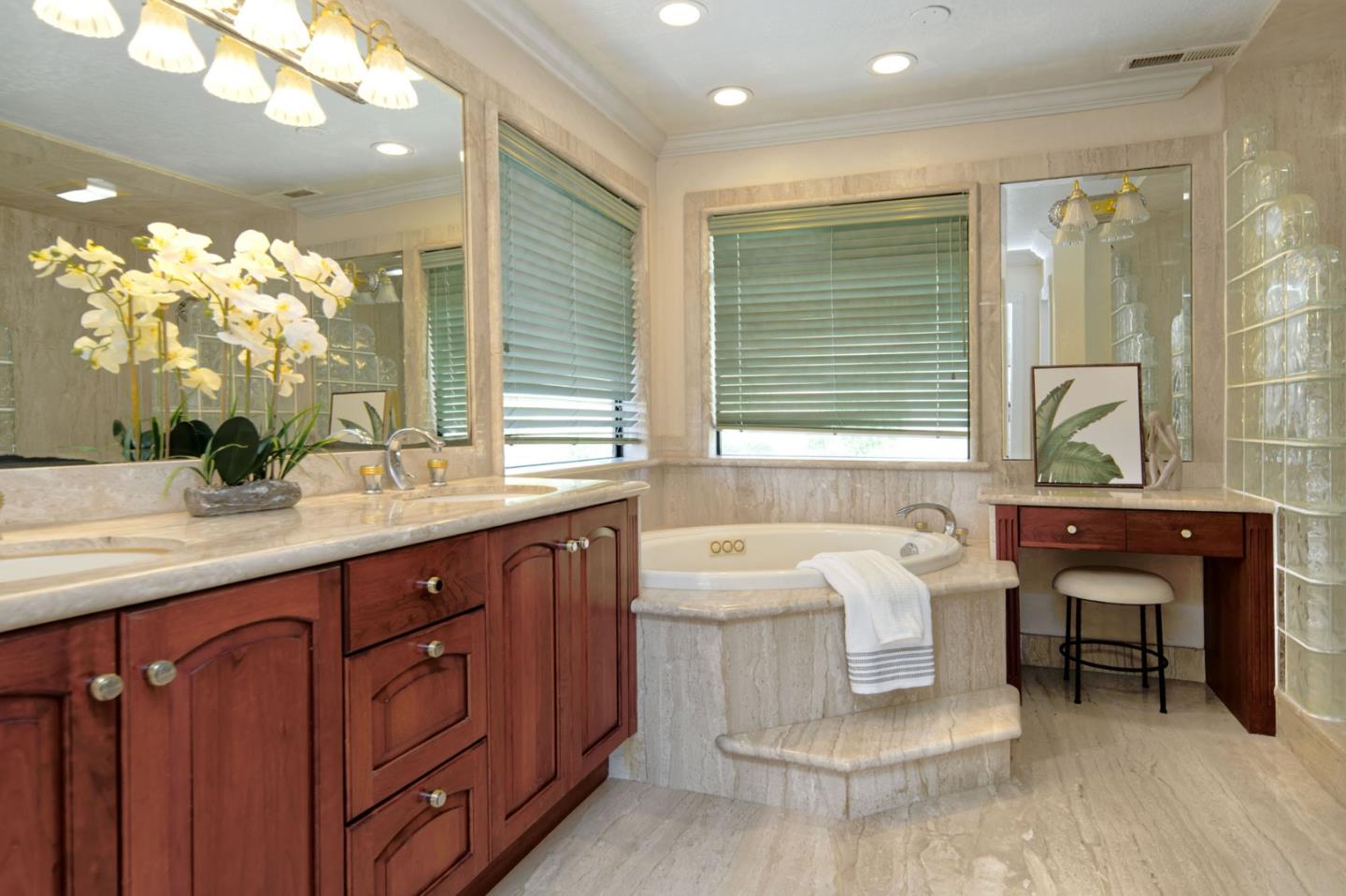 7790 Lost View Road San Jose, CA 95120 - Photo 28 of 48 a spacious bathroom with a double vanity sink a mirror and a bathtub