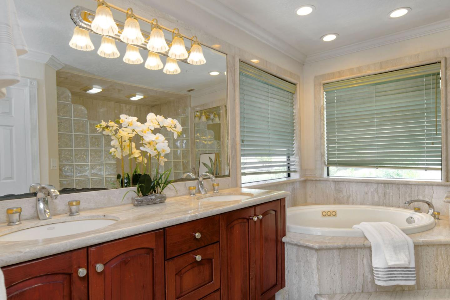 7790 Lost View Road San Jose, CA 95120 - Photo 29 of 48 a bathroom with a sink double vanity mirror and a bathtub